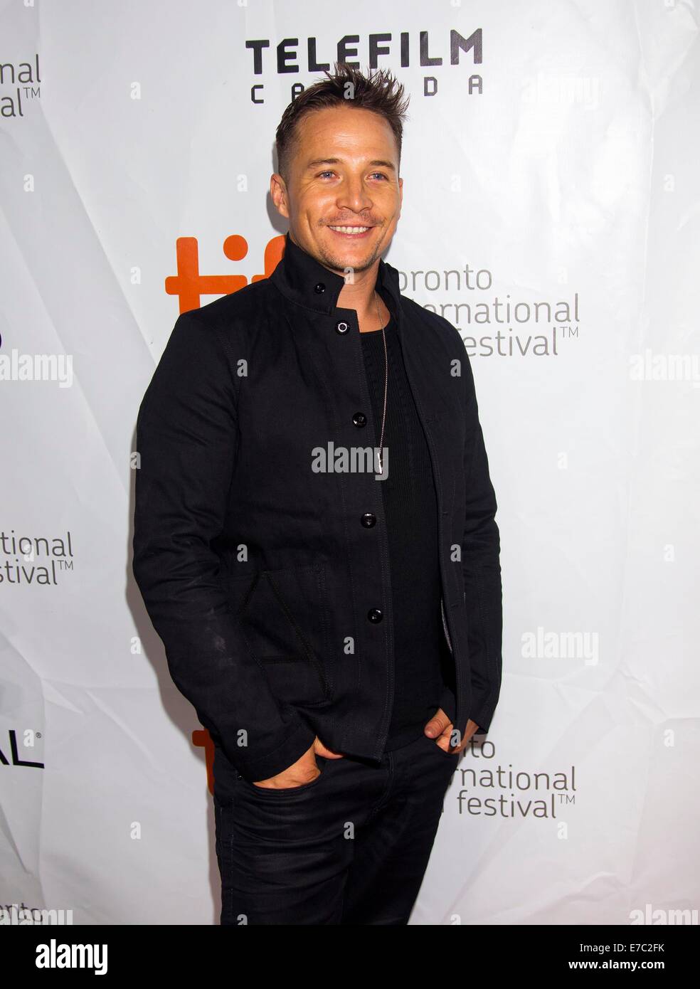 Toronto, Canada. 12th Sep, 2014. Actor Travis Wade poses for photos before the premiere of the film 'The Forger' at Roy Thompson Hall during the 39th Toronto International Film Festival in Toronto, Canada, Sept. 12, 2014. Credit:  Zou Zheng/Xinhua/Alamy Live News Stock Photo