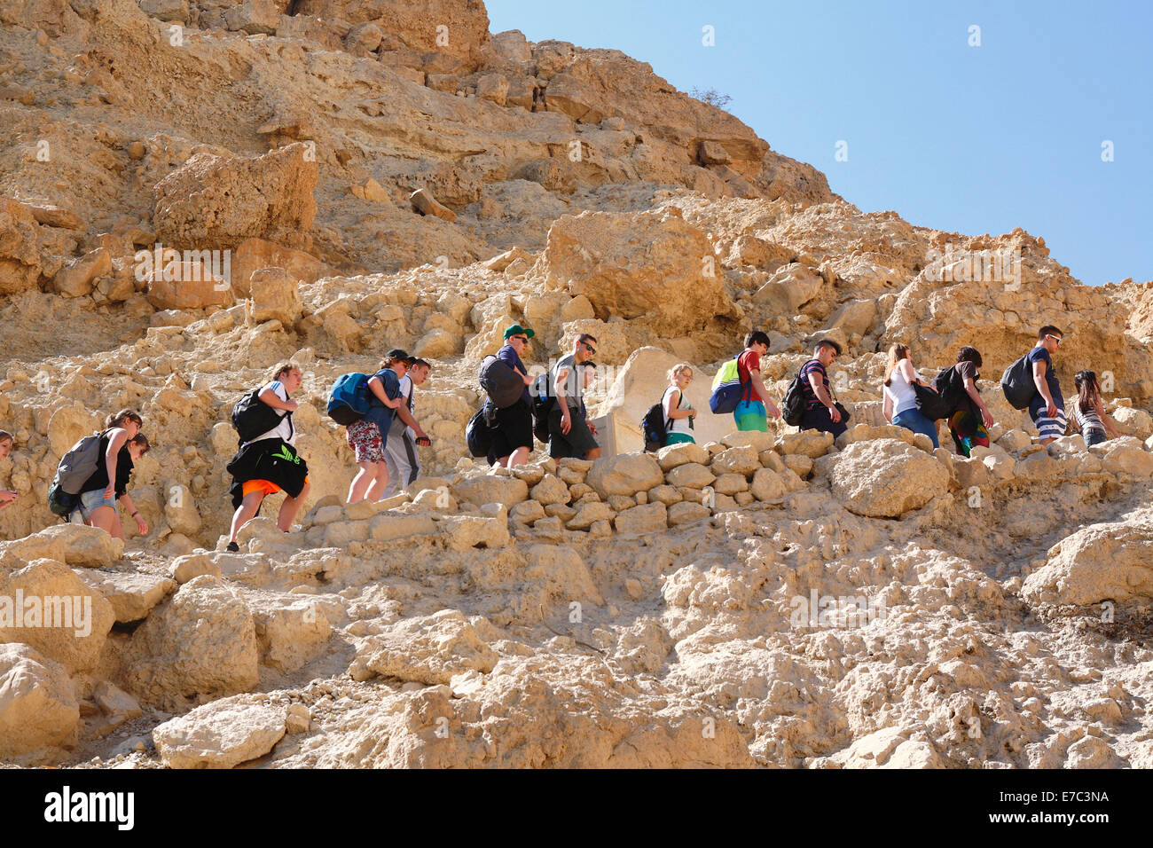 group of people hiking in ein gedi oasis and national park nearby