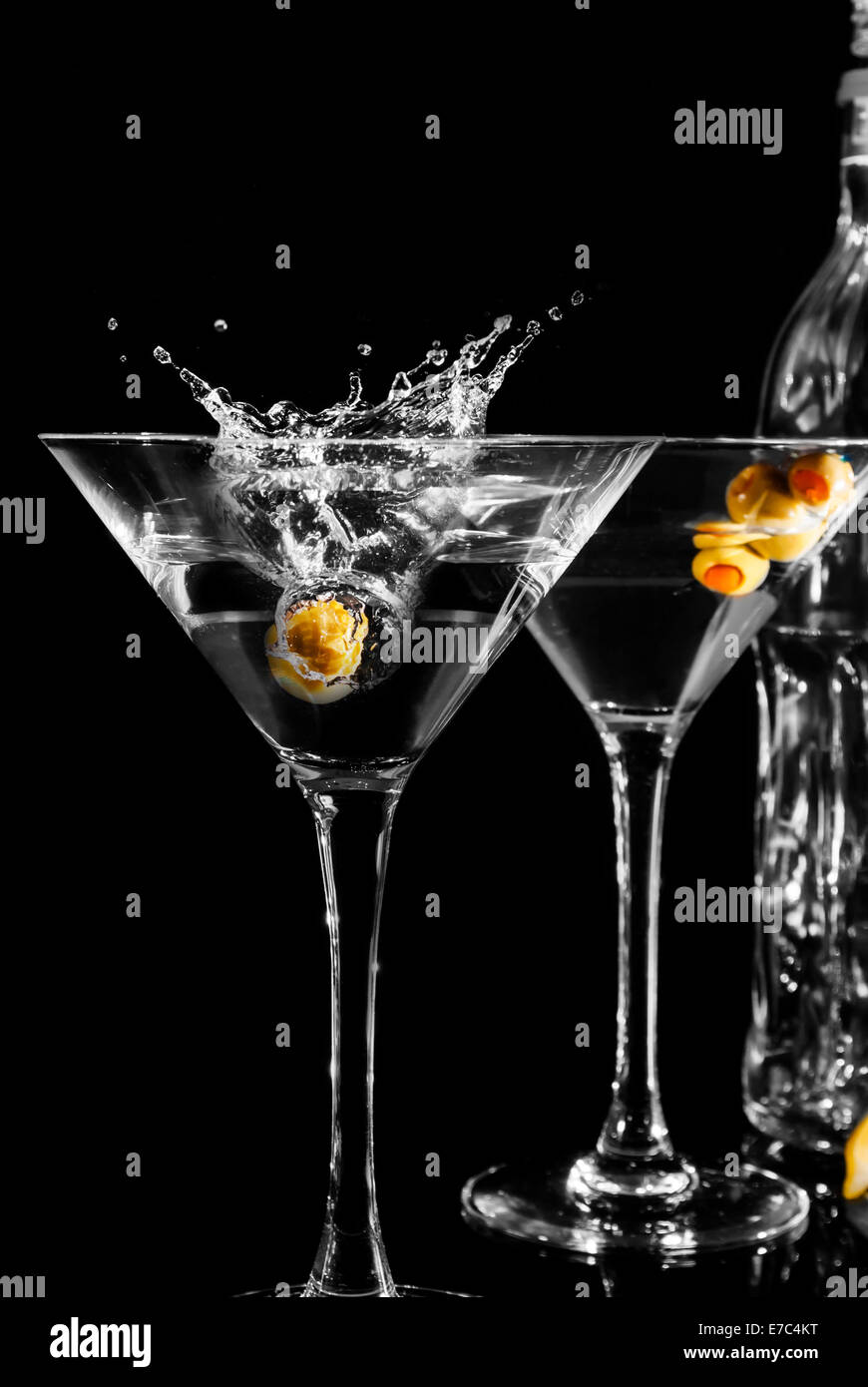 Martini glass with olive on black background Stock Photo
