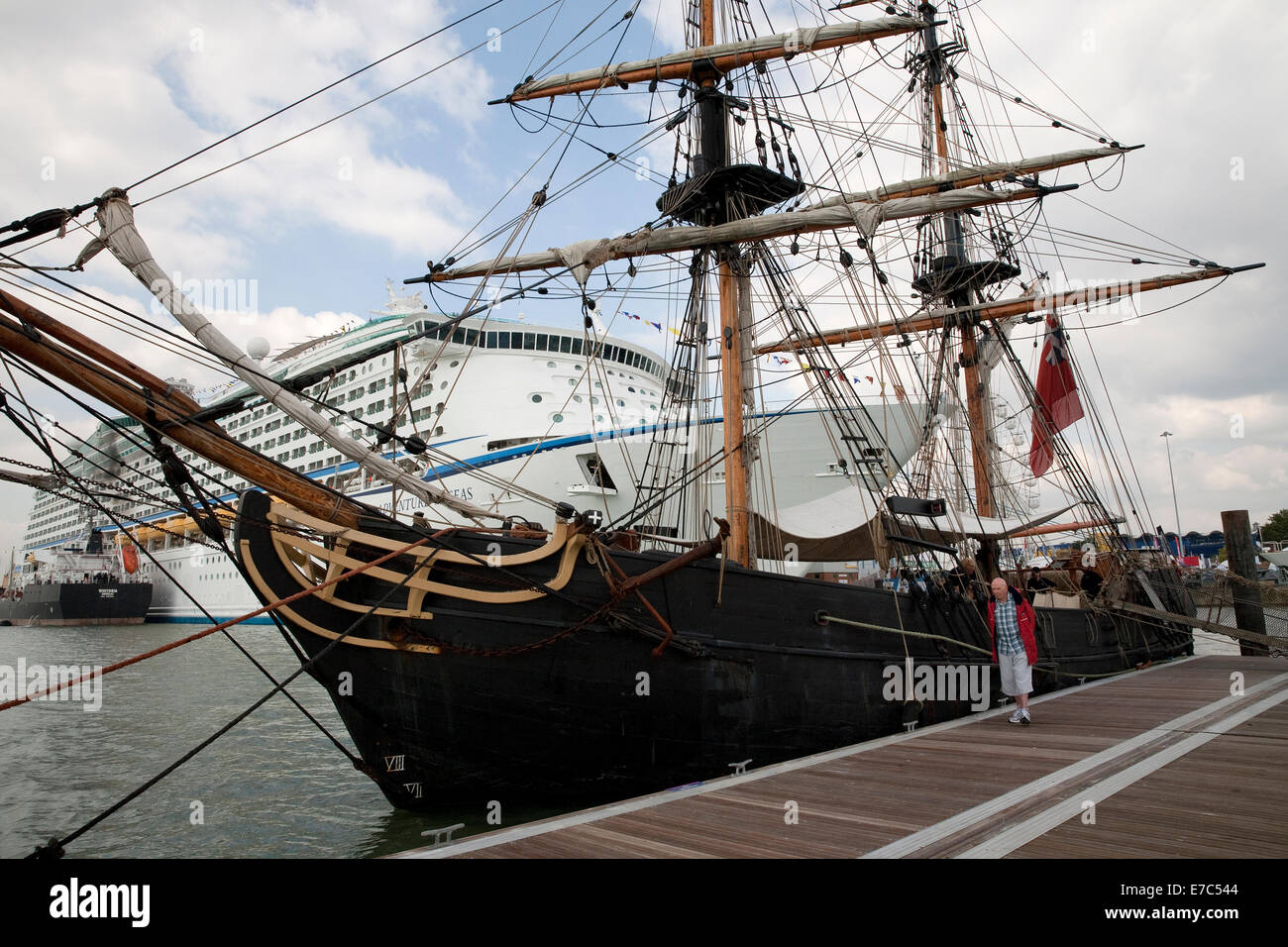 Tall ship Phoenix docks in front of the adventure of the seas cruise ship at the Southampton boat show 2014 Stock Photo