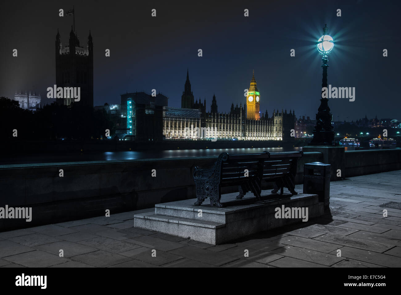 NIght view on Big Ben parliament house in Westmin and double decker classic London bus on London Bridge in London,United Kingdom Stock Photo