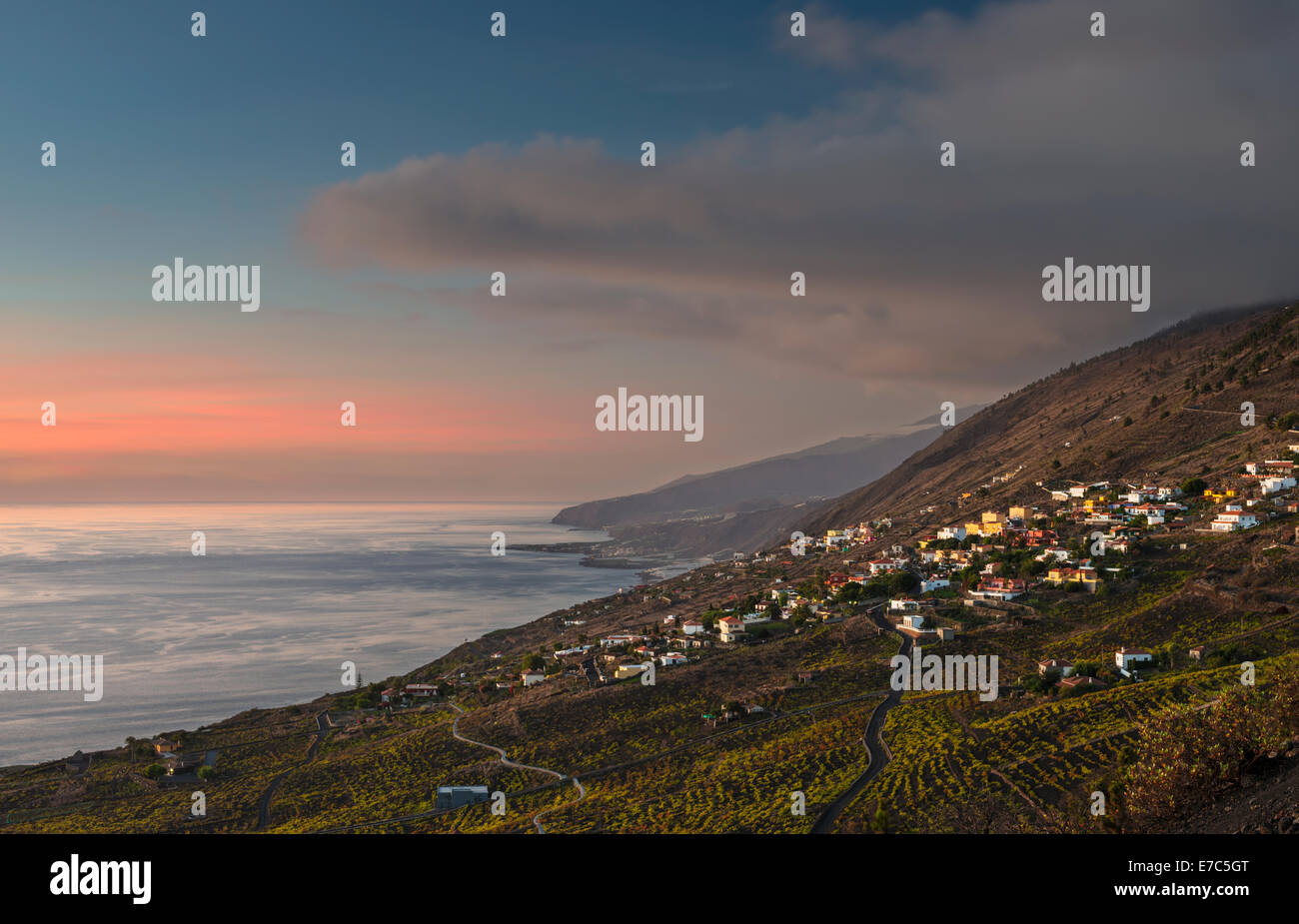 The south-western coast of La Palma, Canary Islands, at dusk looking northwards, with vineyards and the village of Las Indias Stock Photo