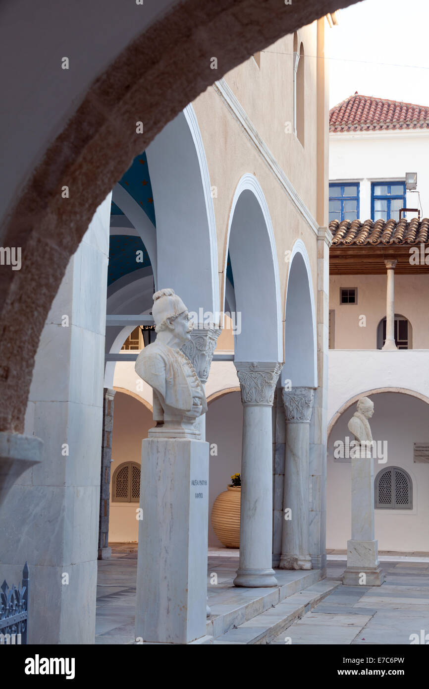 The entrance to Hydra Cathedral, Greece, with statues of the 1821 War of Independence admirals. The closest is Andreas Miaoulis, Stock Photo