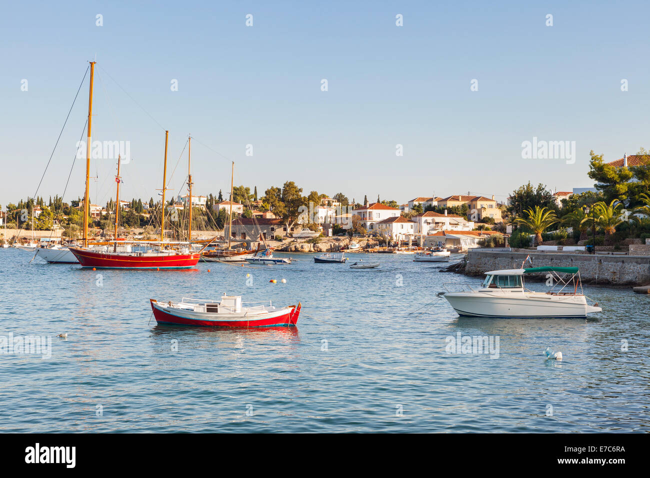 The old harbour on the island of Spetses, in Greece. One or two boat names visible at full size Stock Photo