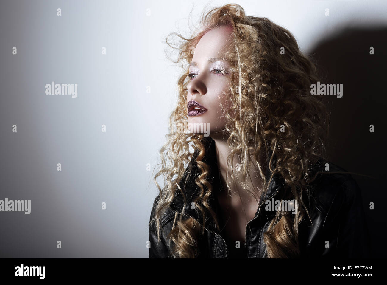 Portrait of Young Woman with Frizzy Hair Stock Photo