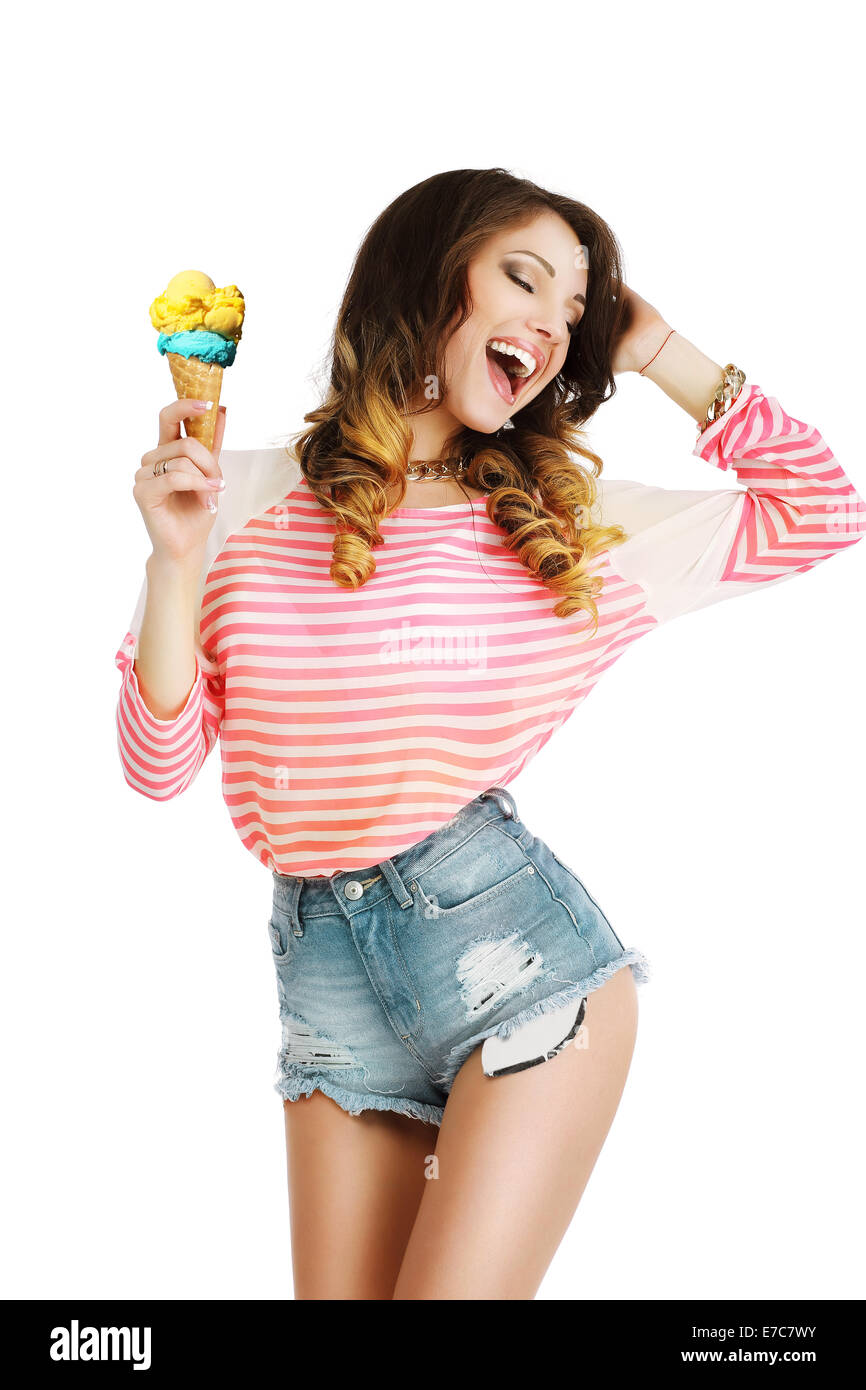 Pleasure. Cute Young Woman with Ice Cream Enjoying Life Stock Photo