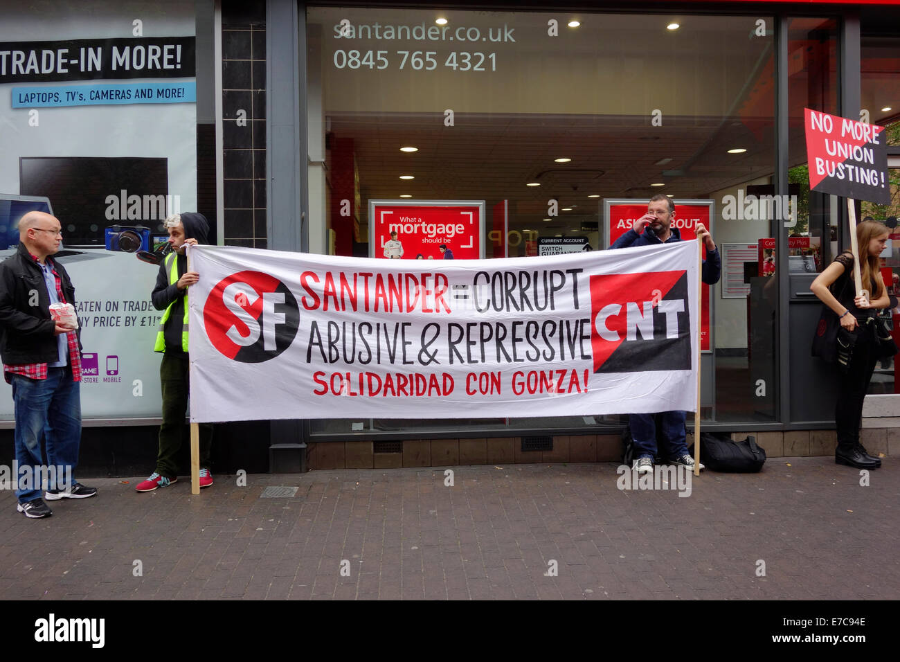 Middlesbrough Cleveland, UK. 13th Sep, 2014. Union protesters picketing a branch of Santander Bank in Middlesbrough Cleveland UK. They are part of a world-wide protest by unions in the IWA, International Workers Association, against the sacking of a Union Militant Activist from an outsourced company working for Santander in Spain. Protesters are asking sympathetic members of the public to complain to Santander Bank customer services. Credit:  Peter Jordan NE/Alamy Live News Stock Photo