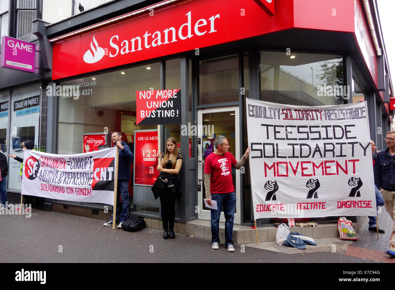 Middlesbrough Cleveland, UK. 13th Sep, 2014. Union protesters picketing a branch of Santander Bank in Middlesbrough Cleveland UK. They are part of a world-wide protest by unions in the IWA, International Workers Association, against the sacking of a Union Militant Activist from an outsourced company working for Santander in Spain. Protesters are asking sympathetic members of the public to complain to Santander Bank customer services. Credit:  Peter Jordan NE/Alamy Live News Stock Photo