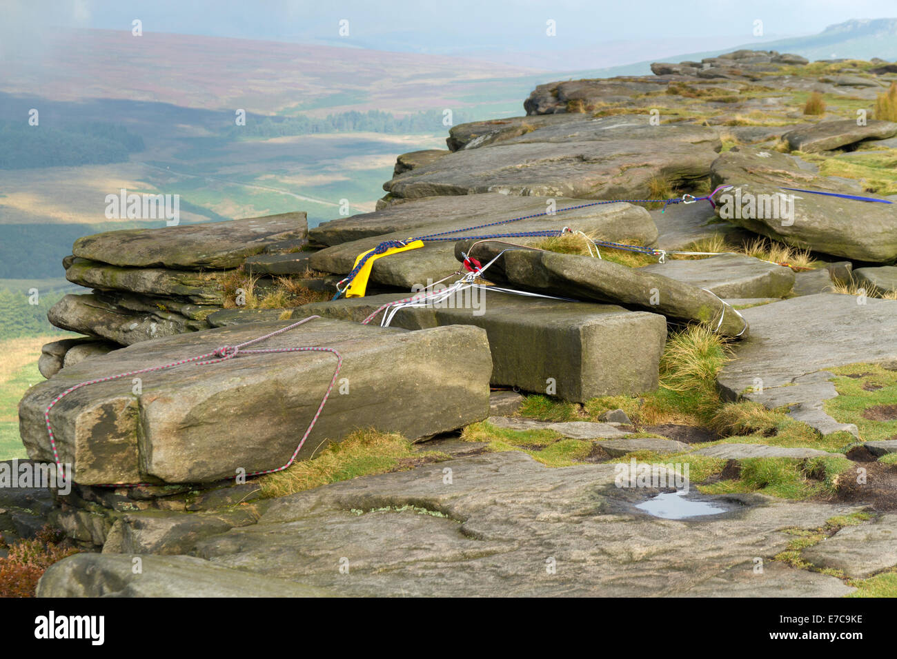 Rock climbing belay and safety anchor ropes fixed at the top of a crag