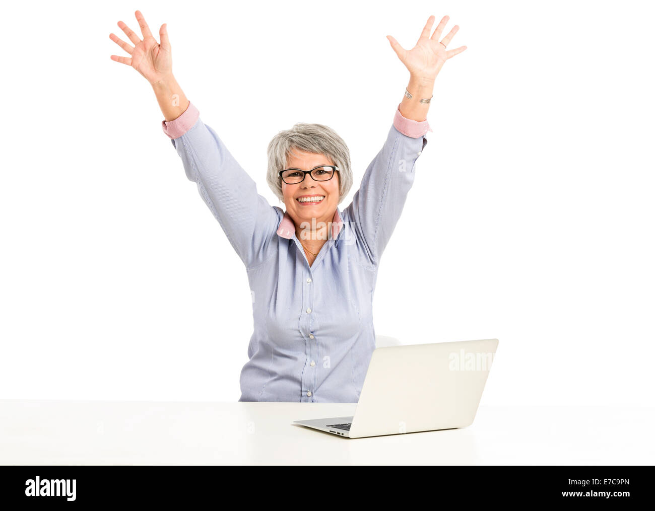 Happy elderly woman working in the office with a laptop Stock Photo - Alamy