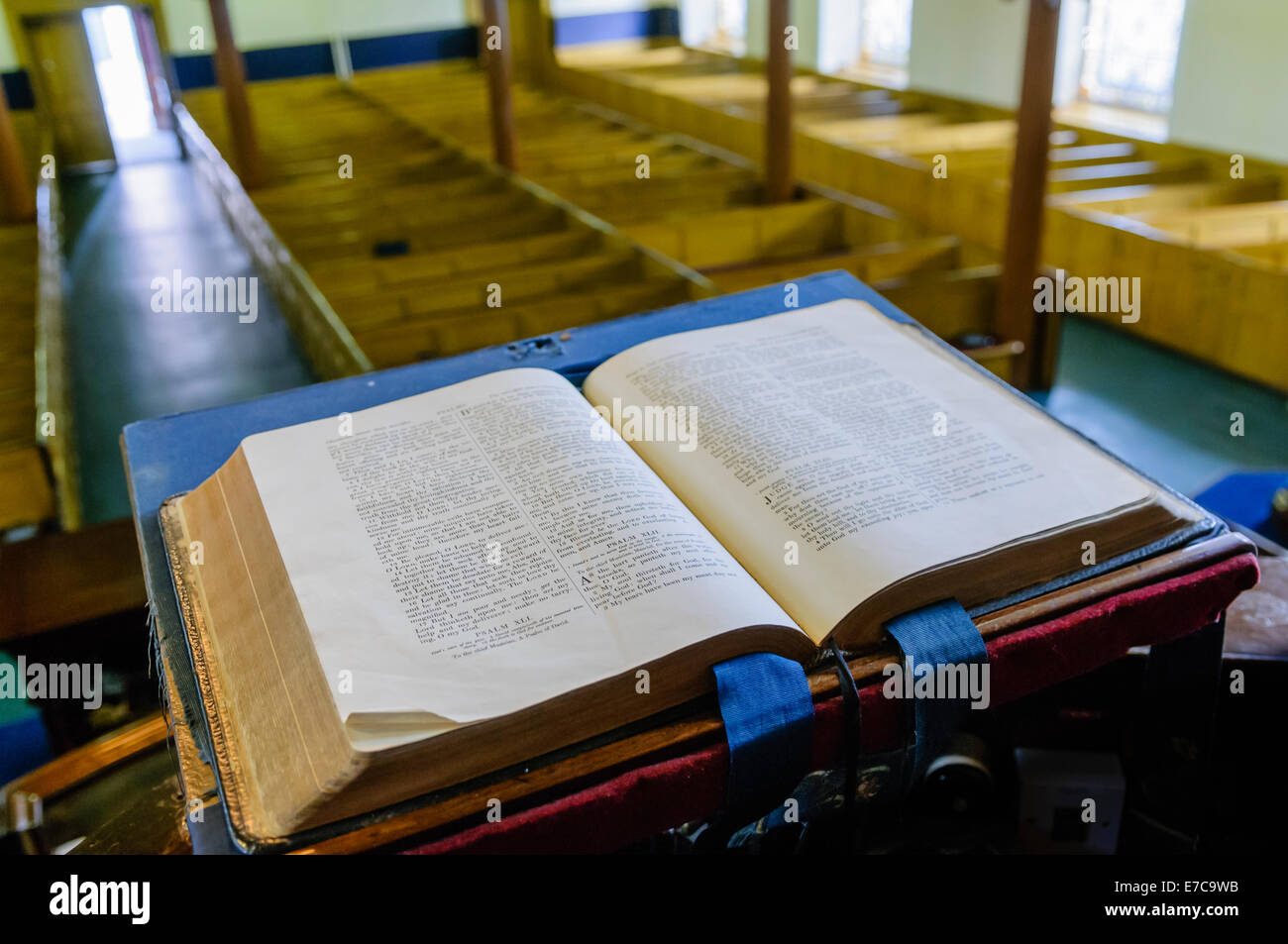 A bible sits open on the altar of a church Stock Photo