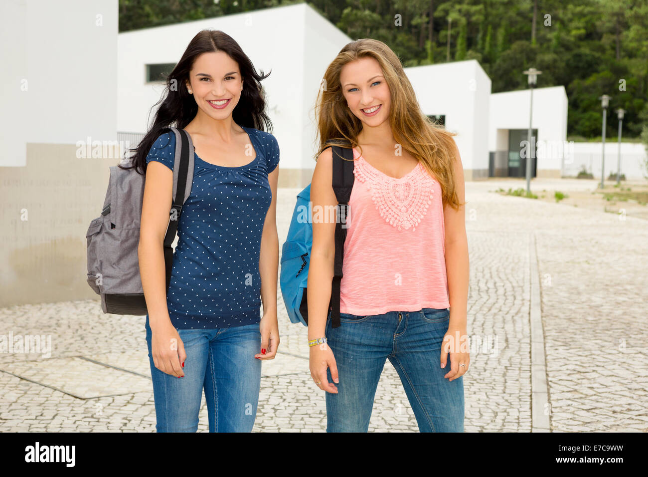 Two beautiful and happy teenage students smiling Stock Photo - Alamy