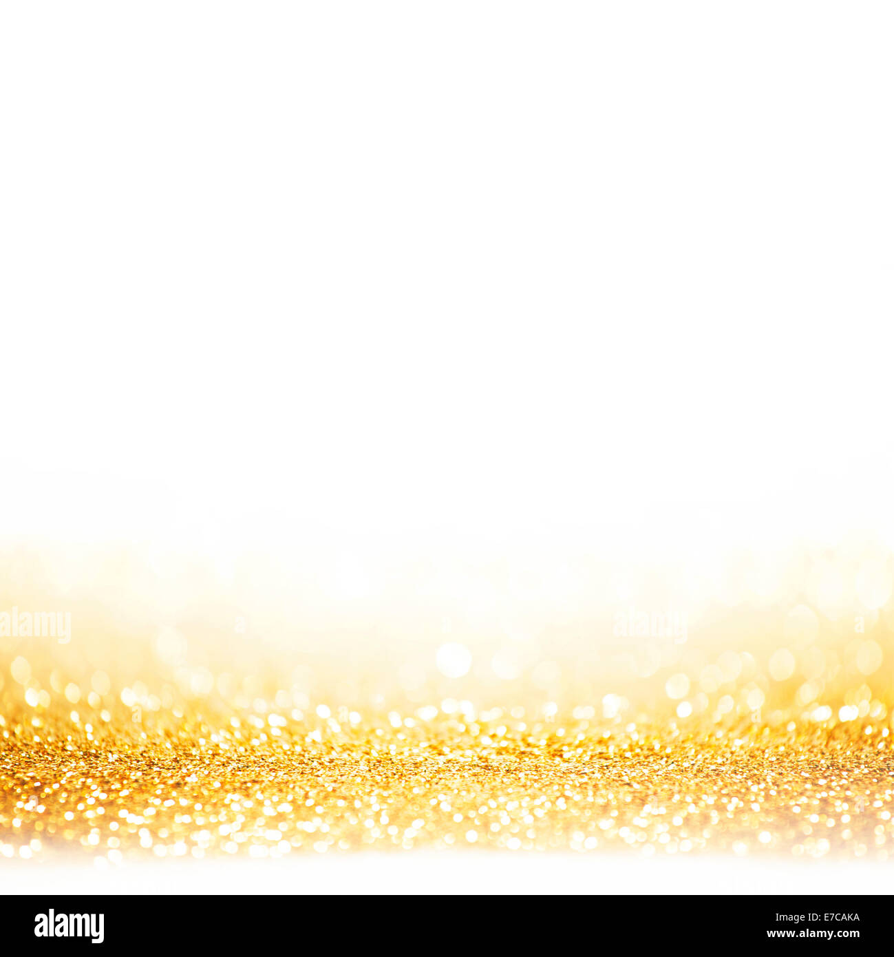 Golden festive glitter background with defocused lights Stock Photo