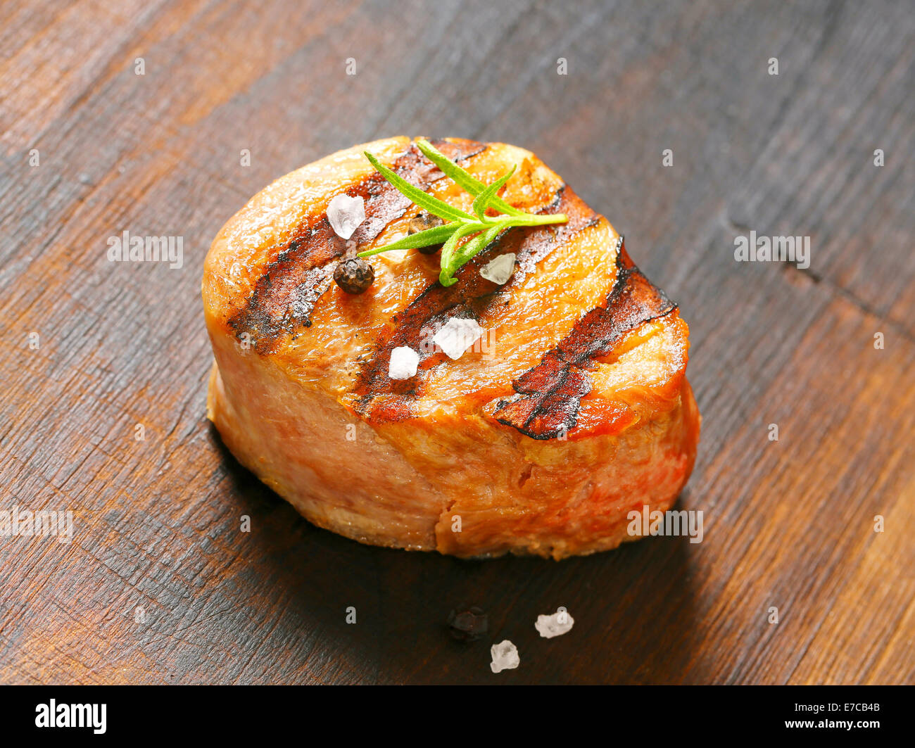 Grilled pork medallion on wood Stock Photo