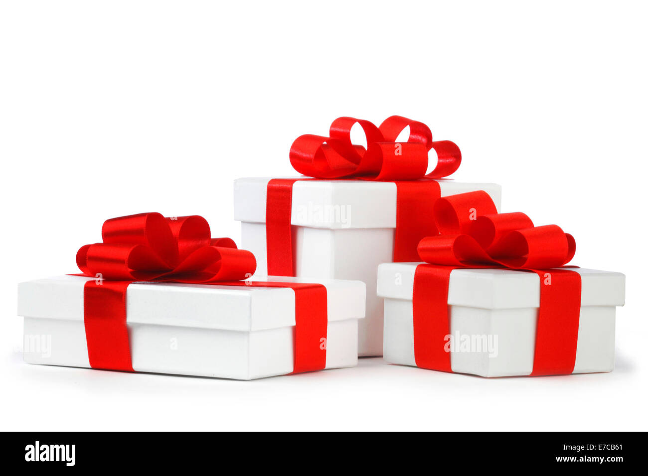 White gift boxes with red ribbon bows isolated on white background
