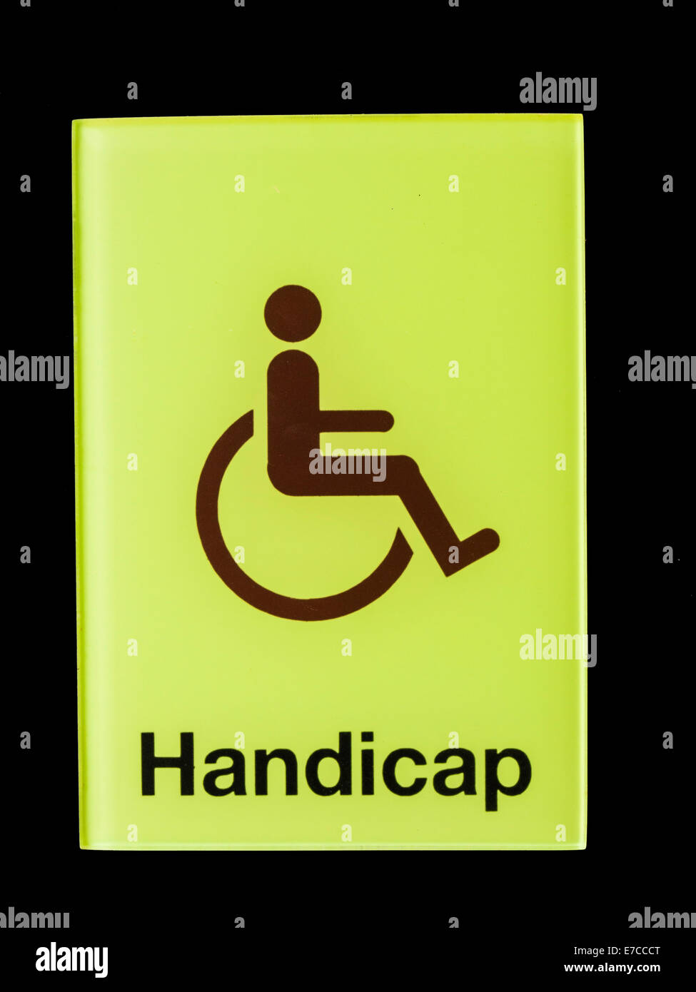 Green glass handicap sign isolated on black background Stock Photo - Alamy