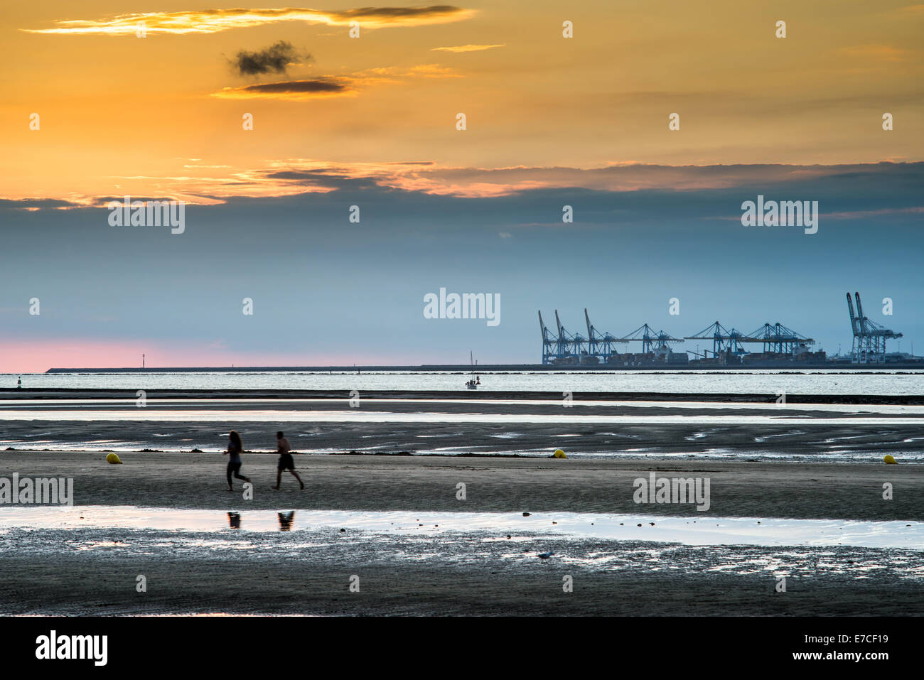 Couple jogging on the beach near Le Havre, Normandy, France, Europe Stock  Photo - Alamy