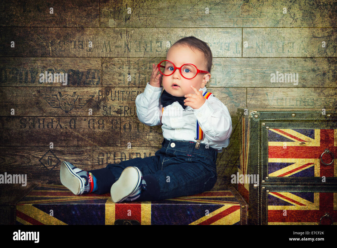 UK Great Britain style, little Englishman in bow-tie and suspenders, with glasses Stock Photo