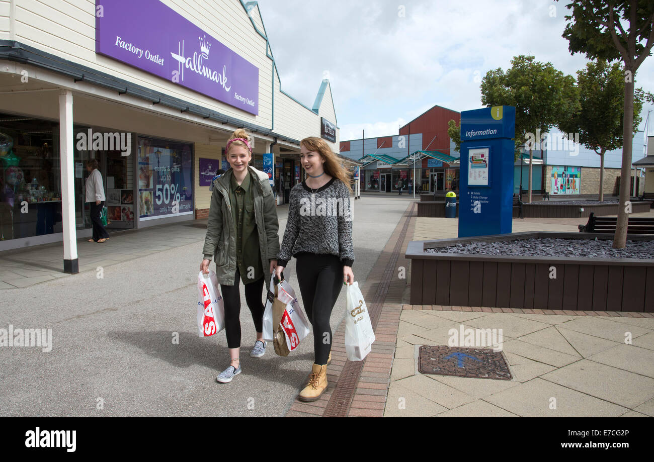 Teenagers shopping at Freeport Fleetwood outlet village Lancashire UK Stock Photo