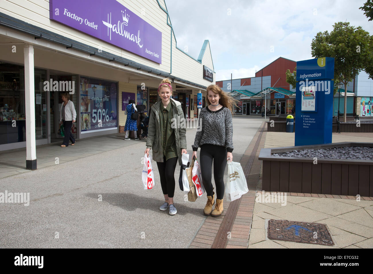 Teenagers shopping at Freeport Fleetwood outlet village Lancashire UK Stock Photo