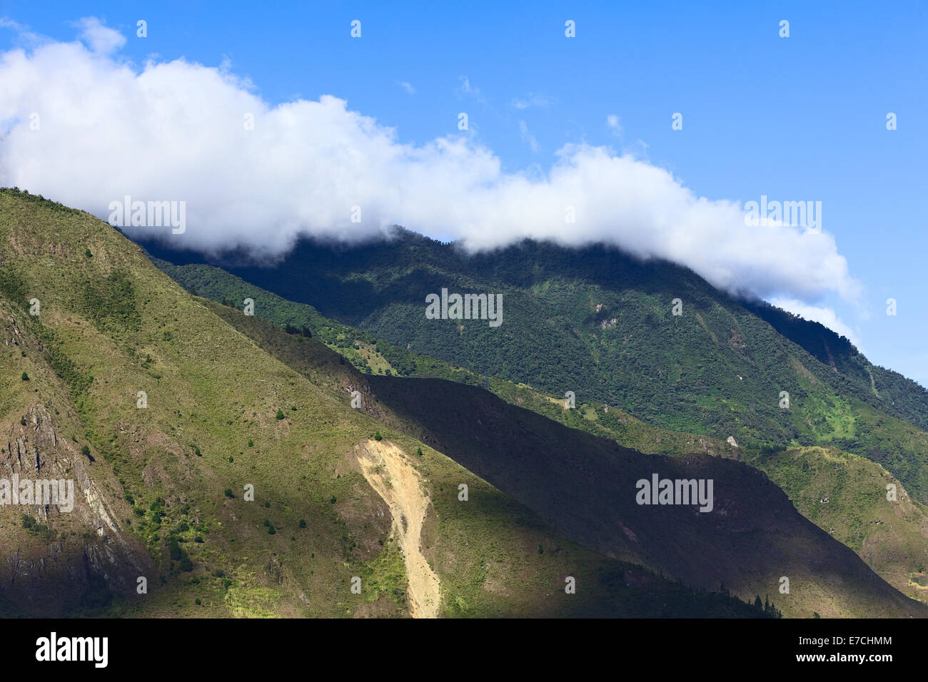 Hills covered by some clouds in the surroundings of the small town of Banos, Tungurahua Province in Central Ecuador Stock Photo