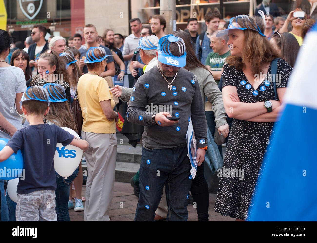 Glasgow, Scotland, UK. 13th September, 2014. Yes supporters covered in stickers and wearing hats during the lead up to the Scottish independence referendum on Buchanan Street, Glasgow, Scotland on Saturday 13th September 2014 Credit:  Iona Shepherd/Alamy Live News Stock Photo