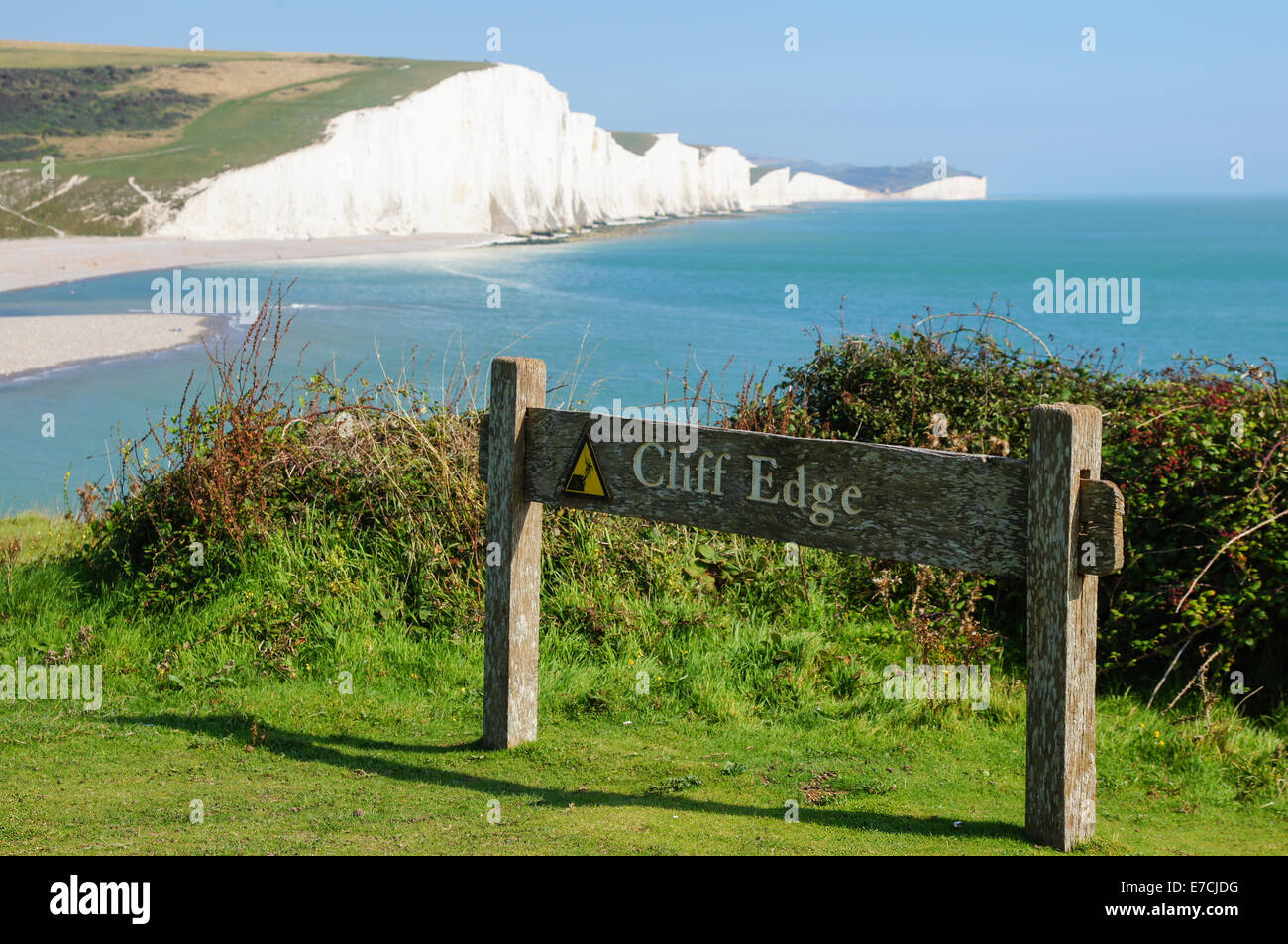 Cliff edge warning sign at Seven Sisters Country Park near Seaford, South Downs Way, South Downs National Park, East Sussex England United Kingdom UK Stock Photo