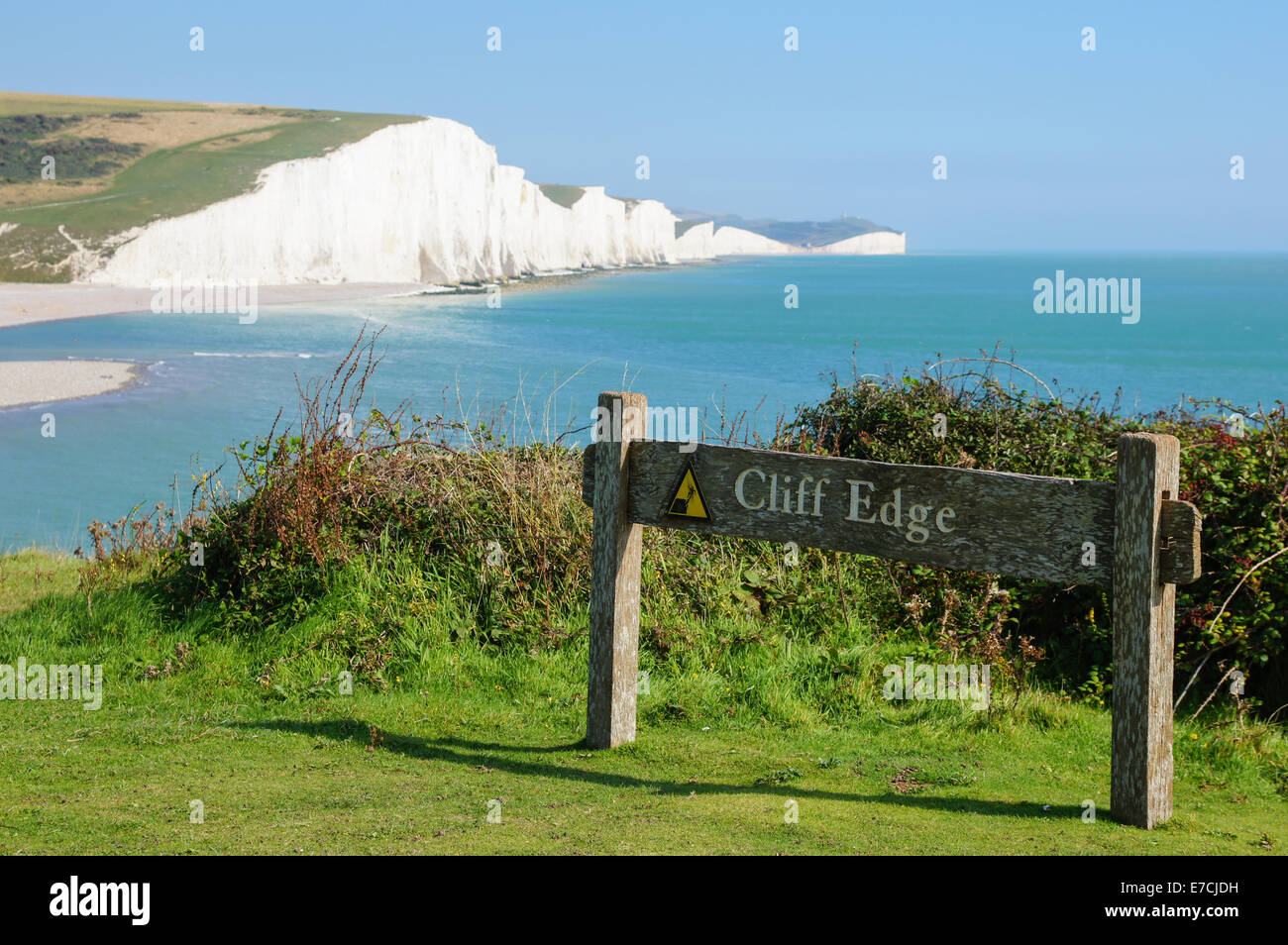 Cliff edge warning sign at Seven Sisters Country Park near Seaford, South Downs Way, South Downs National Park, East Sussex England United Kingdom UK Stock Photo