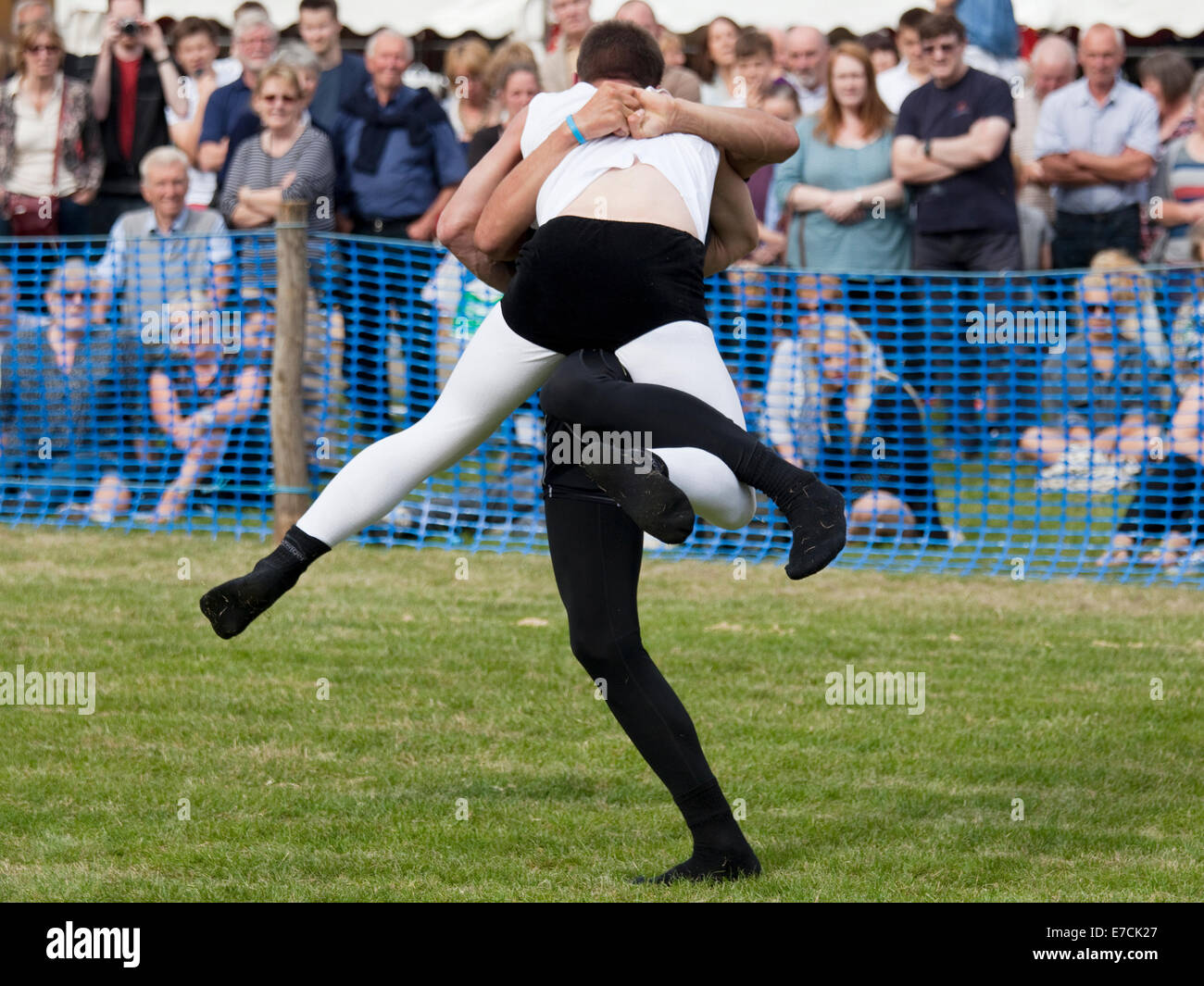 Stanhope, County Durham, England - September 13, 2014: Cumberland and Westmorland Wrestling competition at the Stanhope Show, a traditional Dales agricultural show with displays of livestock, produce and craft from the local area. Cumberland Wrestling is an ancient and well-practised tradition in the north country area of England. Credit:  AC Images/17�Թ����� Live News Stock Photo