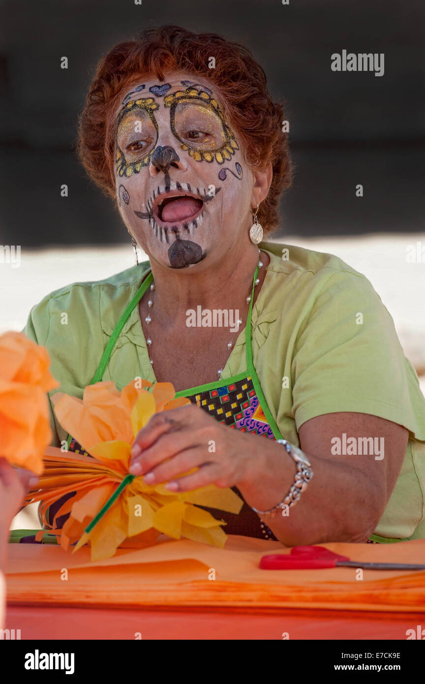 A woman with her face painted as a skull at the 2013 'Dia Del Muerto' happening at the 'Casa de la Guerra' yard in Santa Barbara Stock Photo
