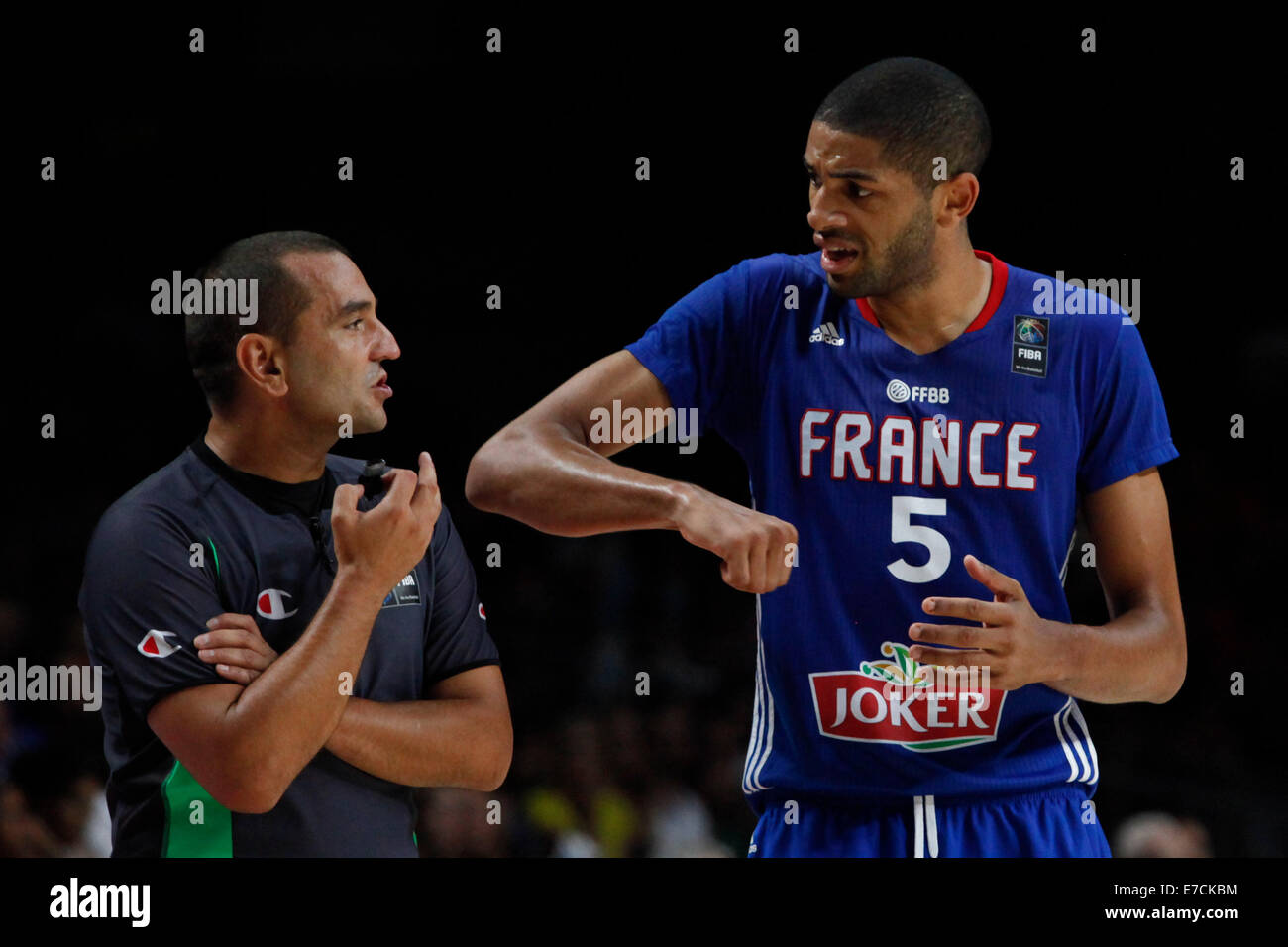 Madrid, Spain. 13th Sep, 2014. Nicolas Batum (R) of France argues with the referee during the third-place match against Lithuania at the 2014 FIBA Basketball World Cup, in Madrid, Spain, on Sept. 13, 2014. France won 95-93. © Victor Blanco/Xinhua/Alamy Live News Stock Photo