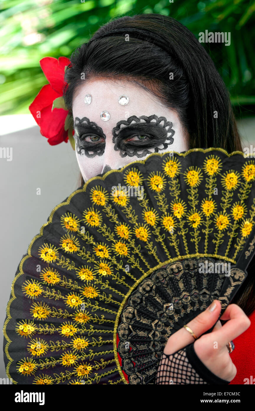 A woman with her face painted as a skull at the 2013 "Dia Del Muerto" happening at the Santa Barbara Museum of Art, Stock Photo
