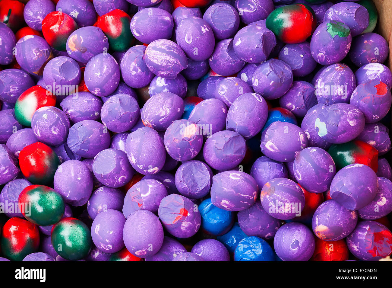 Egg shells filled with confetti & painted with different designs for