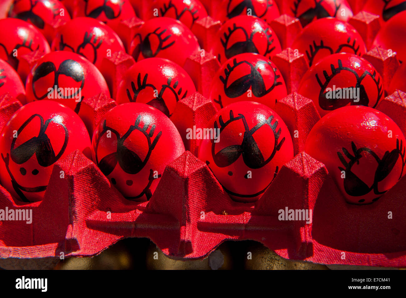 Egg shells filled with confetti & painted with different designs for