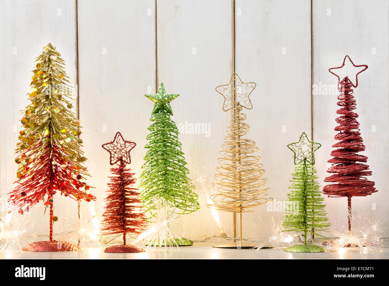 Christmas trees with  lights on wood plank Stock Photo