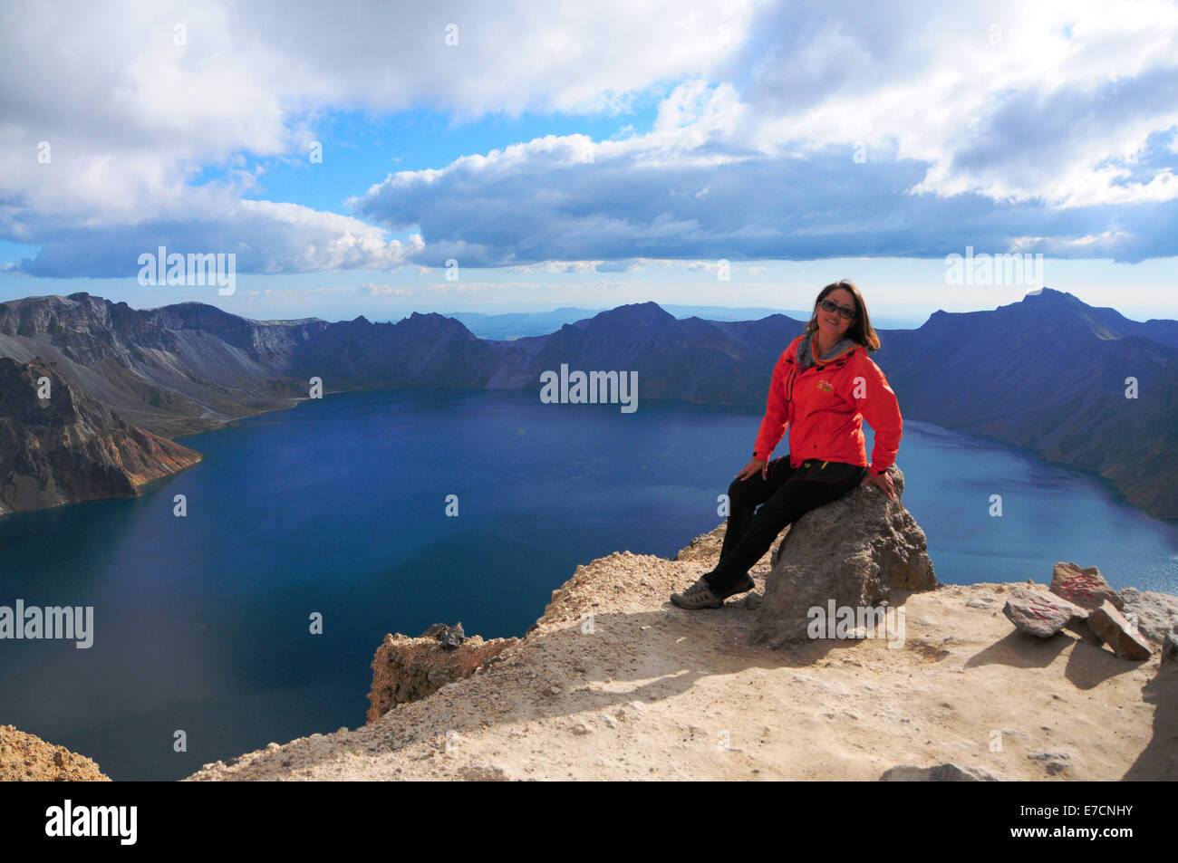Changbai Mountain. 13th Sep, 2014. A tourist poses for photos at