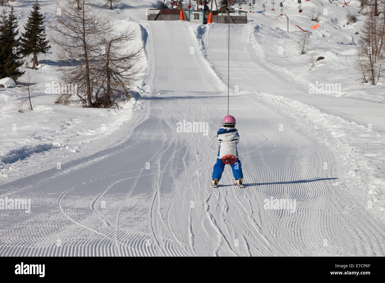 girl in ski lift of an italian ski resort in the dolomites Stock Photo