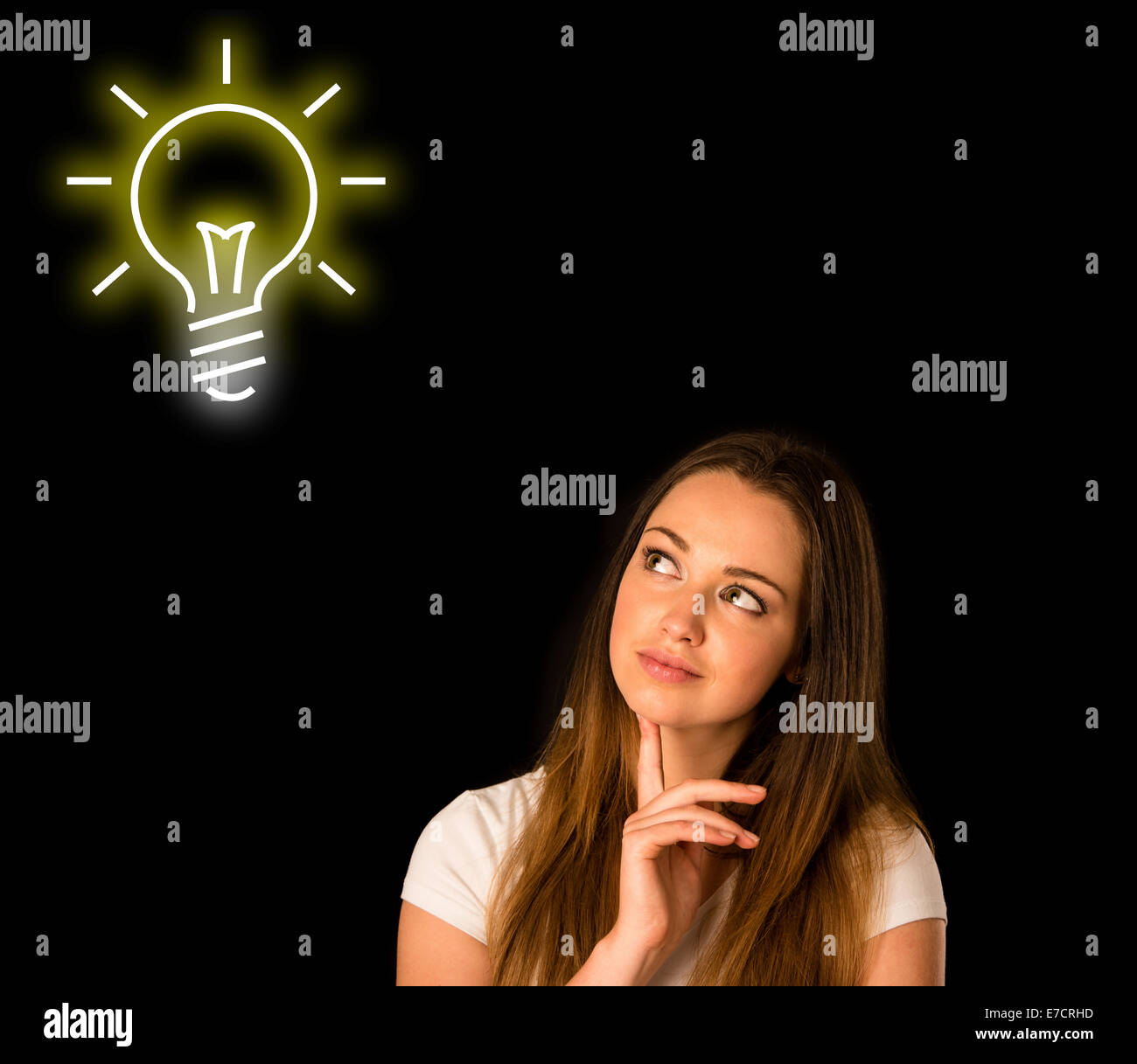 pensive asian caucasian woman looking into copyspace isolated over black Stock Photo