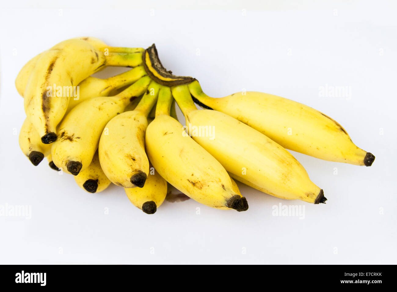 Bunch of gold colored tasty and healthful banana fruits, isolated on white Stock Photo