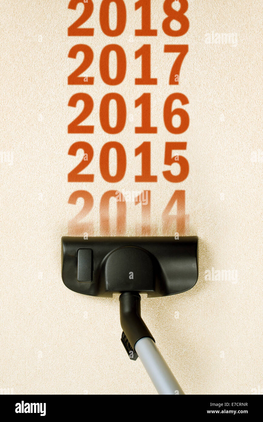 Vacuum Cleaner sweeping year number 2014 from Brand New Carpet leaving sequence 2015, 2016. e.t.c. Happy New 2015 year concept, Stock Photo