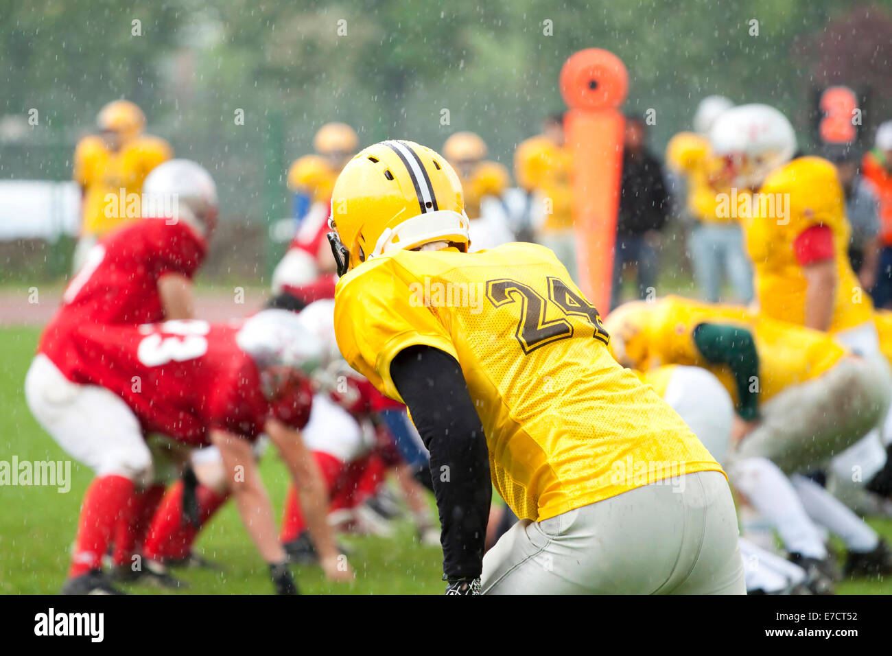 American football game in rain Stock Photo Alamy