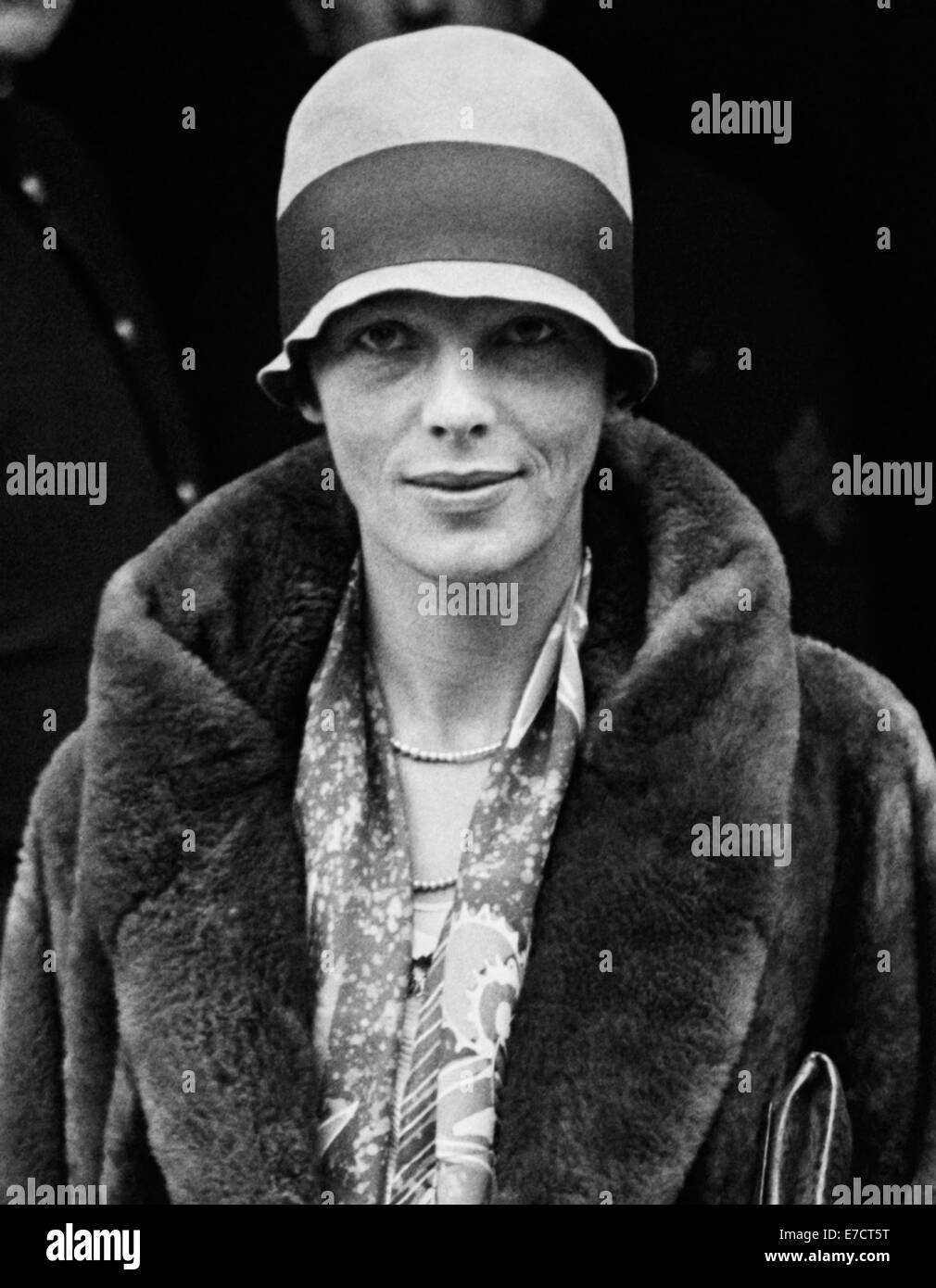 Vintage photo of American aviation pioneer and author Amelia Earhart (1897 – declared dead 1939) – Earhart and her navigator Fred Noonan famously vanished in 1937 while she was trying to become the first female to complete a circumnavigational flight of the globe. Earhart is pictured in November 1928 outside The White House during a visit to see President Calvin Coolidge. Stock Photo