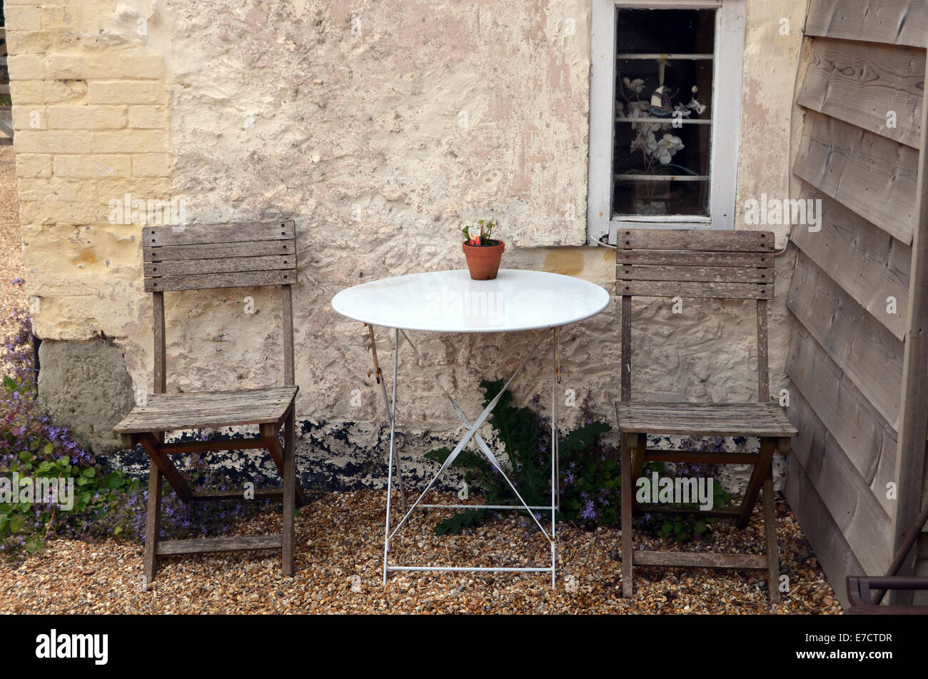 Chairs outside cottage Wiltshire UK 2014 Stock Photo