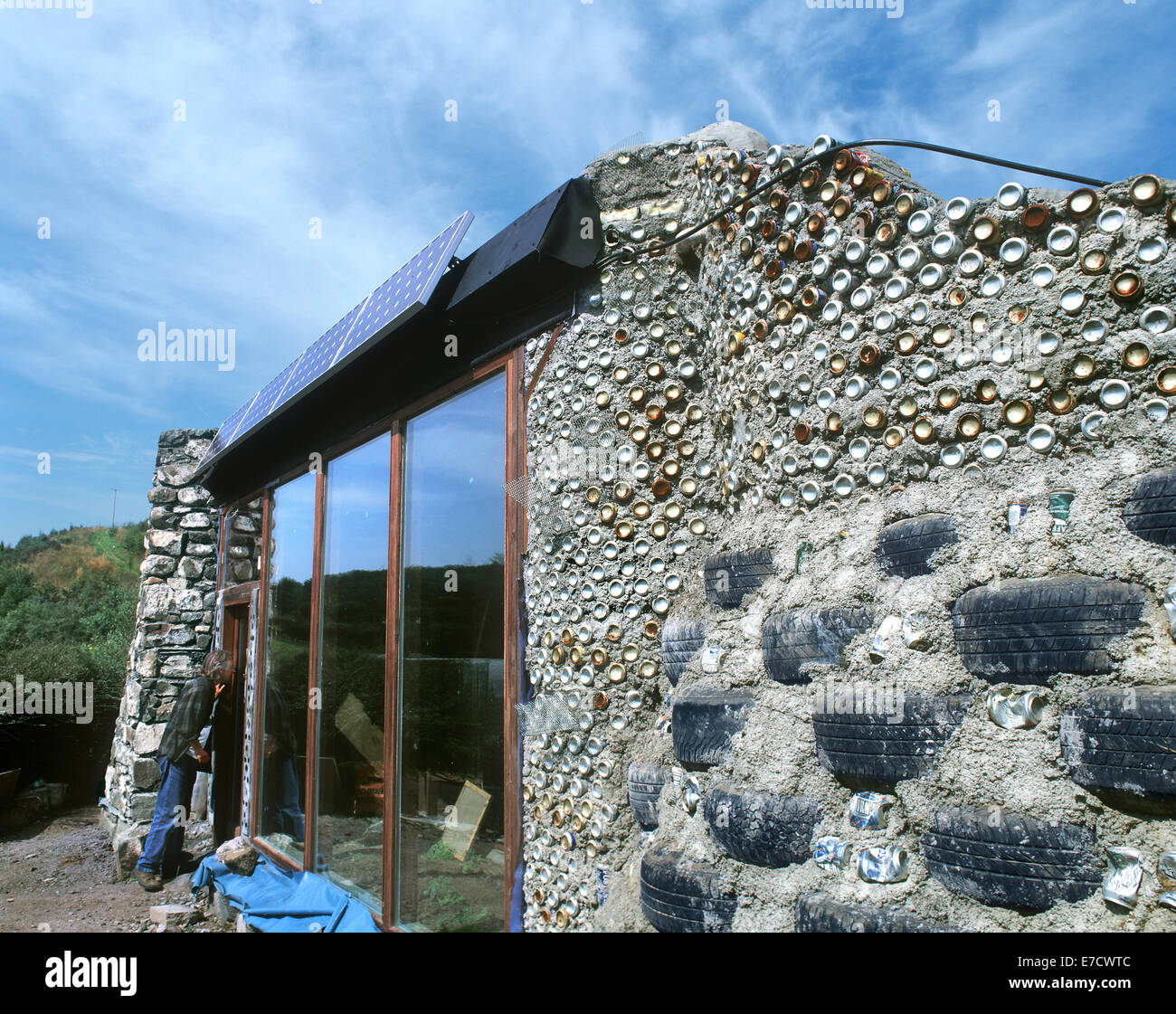 The Fife earthship nearing completion with exposed wall showing reused vehicle tyres and cans, Craigencalt Ecology Centre, Kinghorn, Fife, Scotland. Stock Photo