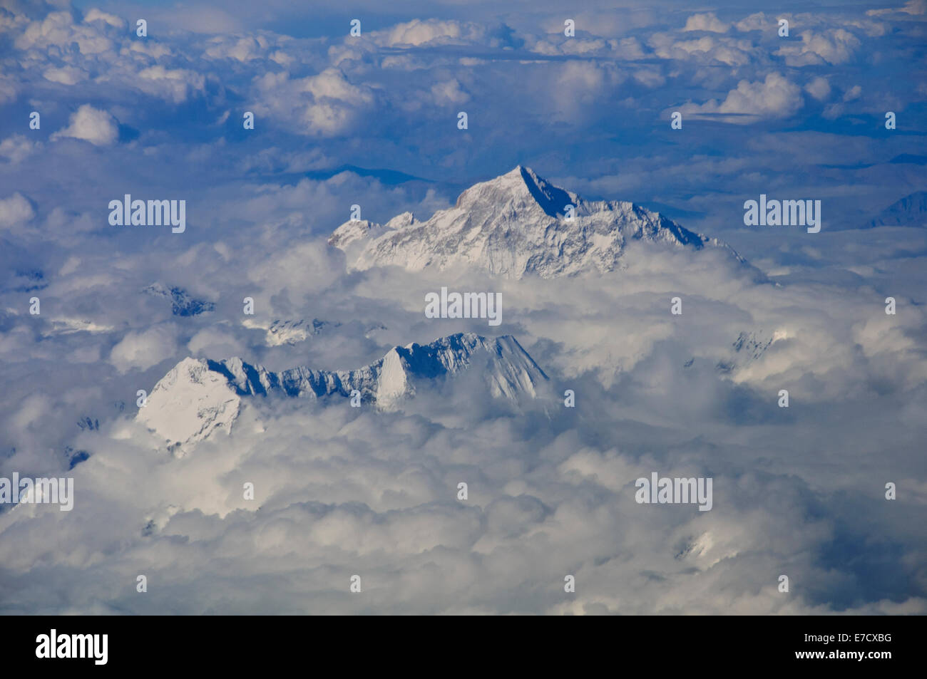 Views of Mount Everest (Highest Peek) and Himalayas through Clouds on Journey with Druk Airlines between Bhutan and Delhi,India Stock Photo