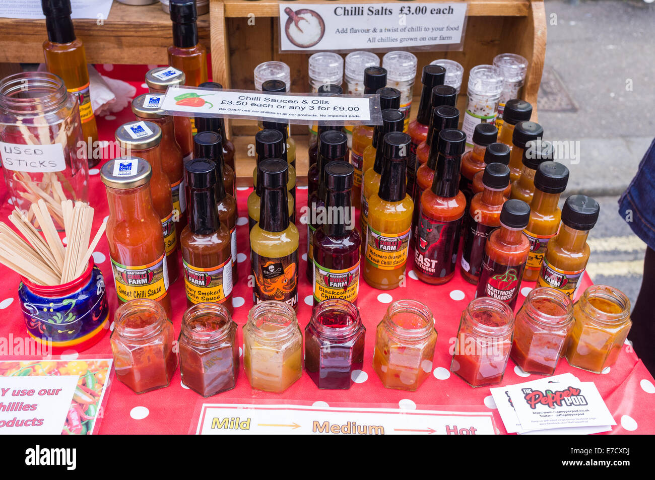 The Ashburton Food & Drink Festival. The Dartmoor Chilli Farm stall showing bottles and jars of their Chilli relishes displayed. Stock Photo