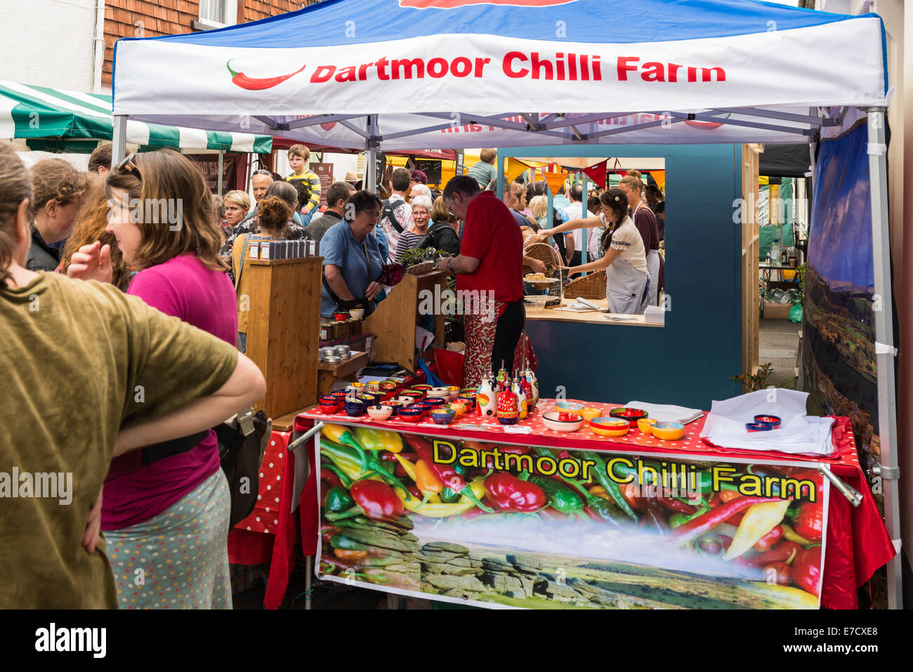 Ashburton Food & Drink Festival market stalls UK. This is from The Dartmoor Chilli Farm stall during a busy time with customers. Stock Photo