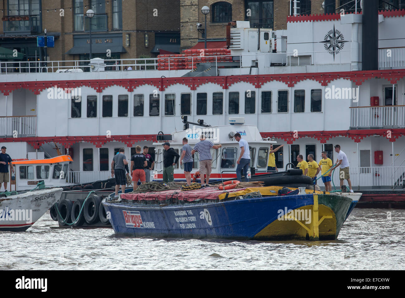 London, UK. 14th September 2014.  Waterman and lightermen, tether the traditional Thames barges to a tug so they can be towed up river to Westminster Bridge for the start of the Steve Faldo Memorial Barge Driving Race Credit:  Neil Cordell/Alamy Live News Stock Photo