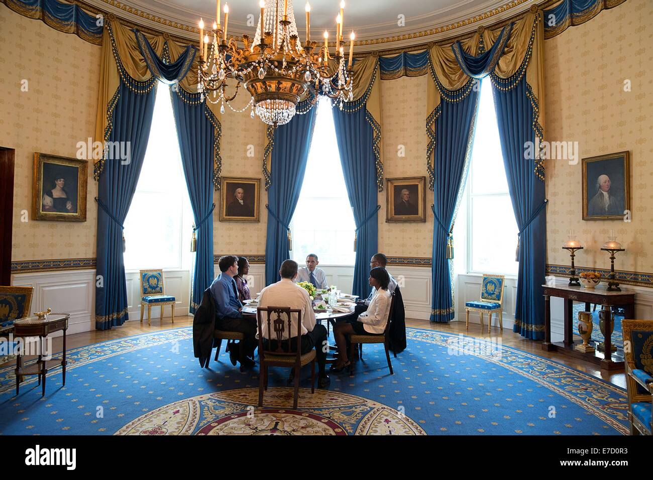 US President Barack Obama hosts Education Secretary Arne Duncan and a group of teachers for lunch in the Blue Room of the White House July 7, 2014 in Washington, DC.  They discuss efforts to ensure that every student is taught by an effective educator. Stock Photo