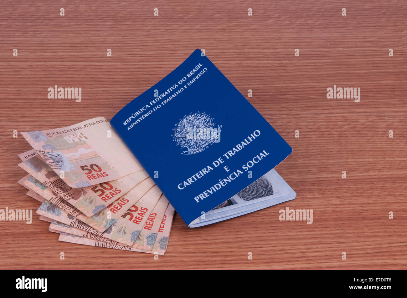 Brazilian work document and social security document (carteira de trabalho) and brazilian currency (Real) Stock Photo